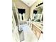 This bathroom features double sinks, a window, a shower and a toilet at 5728 Rocbridge Ln, Charlotte, NC 28208