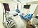 Bright bedroom with high ceilings, ceiling fan, and a cozy spot at 5728 Rocbridge Ln, Charlotte, NC 28208