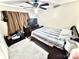 This bedroom features carpet flooring, a ceiling fan, and a dresser with TV at 5728 Rocbridge Ln, Charlotte, NC 28208