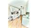 A well-organized kitchen featuring white cabinets, laminate floors, and practical appliances at 5728 Rocbridge Ln, Charlotte, NC 28208