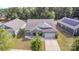 Aerial view of home with manicured lawn in a neighborhood setting with mature trees at 6007 Eleanor Rigby Rd, Charlotte, NC 28278
