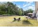 Well-maintained backyard includes seating, hammock, lush lawn, and patio area at 6007 Eleanor Rigby Rd, Charlotte, NC 28278