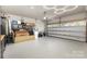 Spacious garage with epoxy floor and plenty of room for storage and activities at 6007 Eleanor Rigby Rd, Charlotte, NC 28278