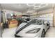 Clean, modern garage with epoxy floor, golf cart and plenty of storage space at 6007 Eleanor Rigby Rd, Charlotte, NC 28278