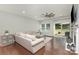 Bright living room with hardwood floors, fireplace, and sliding door to the backyard at 6007 Eleanor Rigby Rd, Charlotte, NC 28278
