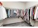 Large walk-in closet with carpeted floors and ample hanging space for clothing at 6007 Eleanor Rigby Rd, Charlotte, NC 28278
