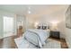 Bright bedroom showcasing a stylish bed, bedside tables, and natural light at 601 Cherokee Rd, Charlotte, NC 28207