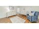 Charming bedroom with hardwood floors, area rug, crib and white dresser, illuminated by natural light at 601 Cherokee Rd, Charlotte, NC 28207