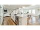 Kitchen with large island and an open floor plan, seamless to dining area and living room at 601 Cherokee Rd, Charlotte, NC 28207