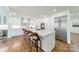 Modern kitchen with white cabinetry, a marble island, and stainless steel appliances at 601 Cherokee Rd, Charlotte, NC 28207
