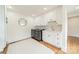 Well-lit laundry room with modern appliances, white cabinets, and hardwood floors at 601 Cherokee Rd, Charlotte, NC 28207