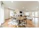 Open floor plan with dining room table, fireplace, and abundant natural light at 601 Cherokee Rd, Charlotte, NC 28207