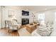 Living room with fireplace, TV, comfortable seating, and stylish decor at 601 Cherokee Rd, Charlotte, NC 28207