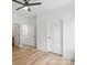 Comfortable bedroom showcasing neutral walls, modern ceiling fan, and a doorway to other rooms at 605 Poplar St, Shelby, NC 28150