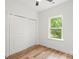 Neutral bedroom with closet and a window that provides natural light at 605 Poplar St, Shelby, NC 28150