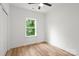 Well-lit bedroom with natural light and wood-look floors, providing a modern and inviting space at 605 Poplar St, Shelby, NC 28150