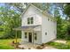 Charming two-story home with white siding, a covered porch, and simple landscaping at 605 Poplar St, Shelby, NC 28150