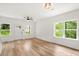 Bright living room with hardwood floors, a ceiling fan, and lots of natural light at 605 Poplar St, Shelby, NC 28150