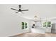 Open-concept living space with a kitchen, hardwood floors, modern lighting, and natural light at 605 Poplar St, Shelby, NC 28150