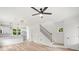 Open-concept living space with a kitchen, stairs, hardwood floors, and lots of light at 605 Poplar St, Shelby, NC 28150