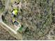 Aerial view of property showcasing surrounding trees, a driveway, and a nearby creek at 6544 Helens Way, Denver, NC 28037