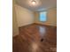 Neutral bedroom featuring clean lines, natural light and wood-look flooring at 6544 Helens Way, Denver, NC 28037