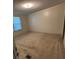 Bright bedroom with a large window and neutral carpet, perfect for relaxation at 6544 Helens Way, Denver, NC 28037