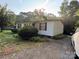 Well-maintained home with a gravel driveway, attractive landscaping, and inviting curb appeal at 6544 Helens Way, Denver, NC 28037