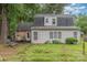 Exterior shot of the back of the house and backyard with trees at 6577 Stoney Ridge Rd, Matthews, NC 28104