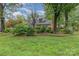 Charming front exterior with lush landscaping at 6577 Stoney Ridge Rd, Matthews, NC 28104