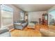 Spacious living room featuring hardwood floors, neutral walls, classic furnishings, and plenty of natural light at 6577 Stoney Ridge Rd, Matthews, NC 28104