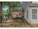 Back patio area featuring chairs and a table on a concrete slab at 6577 Stoney Ridge Rd, Matthews, NC 28104