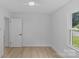 Bedroom with a door, closet, and a window offering a view of the outdoors at 7219 Brynhurst Dr, Charlotte, NC 28210