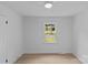 Bright bedroom with a ceiling fan, a window view, and neutral wall color at 7219 Brynhurst Dr, Charlotte, NC 28210