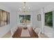 Bright dining room featuring modern light fixture and large windows at 7219 Brynhurst Dr, Charlotte, NC 28210