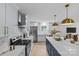 Spacious kitchen featuring an eat-in island and stainless steel appliances at 7219 Brynhurst Dr, Charlotte, NC 28210