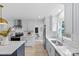Bright kitchen with stainless steel appliances and an eat in island at 7219 Brynhurst Dr, Charlotte, NC 28210