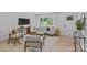 Cozy living room with large windows allowing natural light to flow at 7219 Brynhurst Dr, Charlotte, NC 28210
