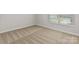 Neutral bedroom with beige carpet, white trim, and a bright window at 7225 Jerimoth Dr, Charlotte, NC 28215