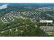 Wide aerial view of the desirable neighborhood and the location of the home near a lake at 7328 Strawberry Fields Ln, Charlotte, NC 28278