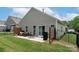 Spacious backyard with a patio, seating, and well-maintained lawn, perfect for outdoor living and entertaining at 7328 Strawberry Fields Ln, Charlotte, NC 28278