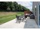 Backyard patio with outdoor furniture and a well-maintained lawn, perfect for enjoying the outdoors at 7328 Strawberry Fields Ln, Charlotte, NC 28278