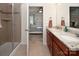 Bathroom with granite countertops, double sinks, and glass-enclosed shower, offering a modern design at 7328 Strawberry Fields Ln, Charlotte, NC 28278