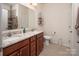 Bathroom featuring double sinks with granite countertops, offering both style and functionality at 7328 Strawberry Fields Ln, Charlotte, NC 28278