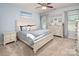Charming bedroom with serene blue walls, a queen bed, and soft natural light, ideal for relaxation at 7328 Strawberry Fields Ln, Charlotte, NC 28278