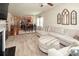 Spacious living area featuring a comfortable sectional, open layout, and seamless flow to the dining and kitchen spaces at 7328 Strawberry Fields Ln, Charlotte, NC 28278