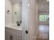 Stylish half-bathroom featuring modern fixtures, a sleek vanity, and a well-lit mirror, exuding contemporary charm at 823 32Nd Ne St, Conover, NC 28613
