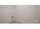 Bright, minimalist walk-in closet with neutral walls, light floors and wire shelving for optimal storage at 823 32Nd Ne St, Conover, NC 28613