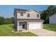 Charming two-story home with gray siding, a front-facing garage, and a well-manicured lawn at 823 32Nd Ne St, Conover, NC 28613