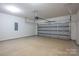Spacious two-car garage with concrete flooring and an automatic door system at 823 32Nd Ne St, Conover, NC 28613
